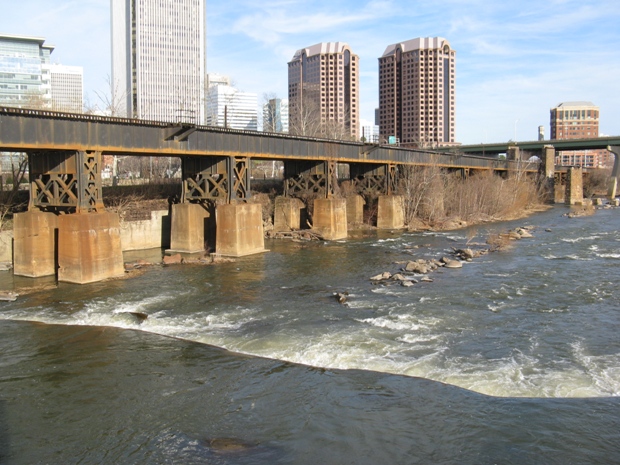 Train Trestle Against Downtown Background